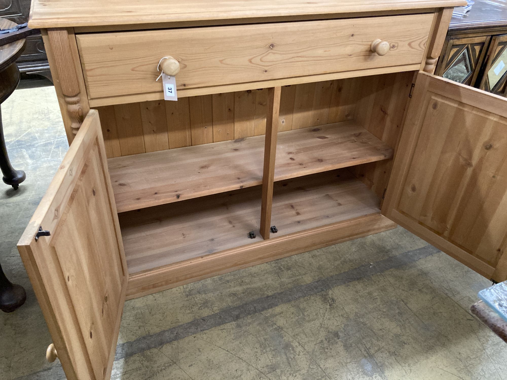 A reproduction pine sideboard, length 122cm, depth 40cm, height 106cm